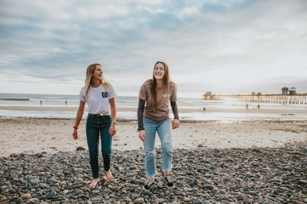 Friends laughing on beach